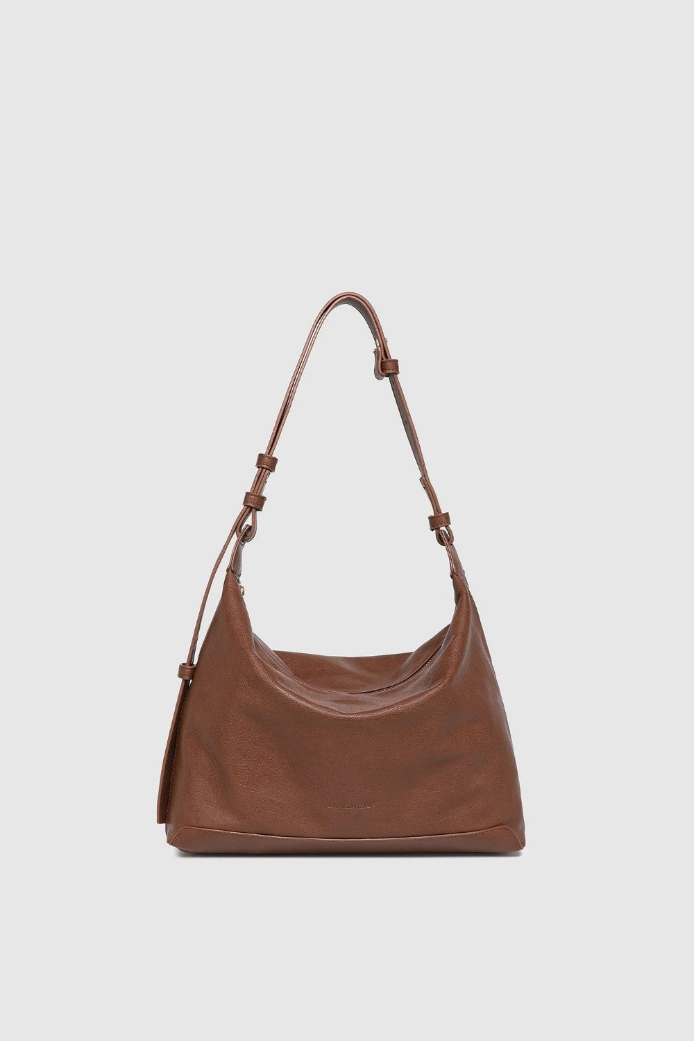 Brown leather handbag with a strap on a light gray background