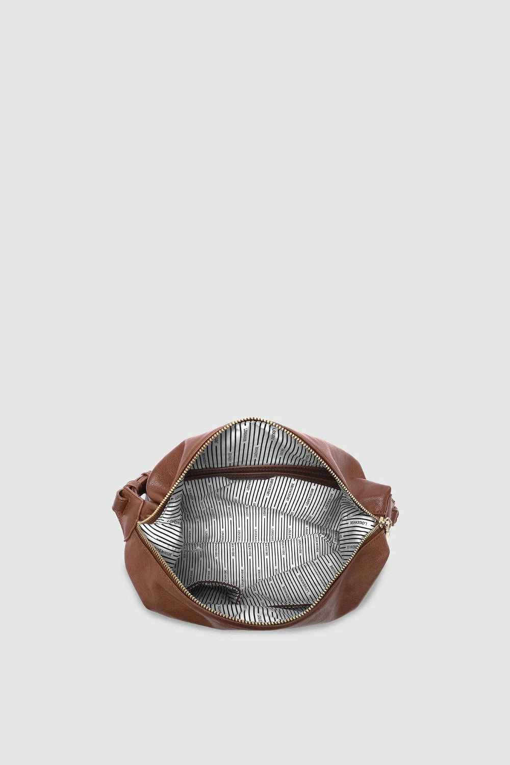 Brown leather handbag with a striped lining on a light gray background