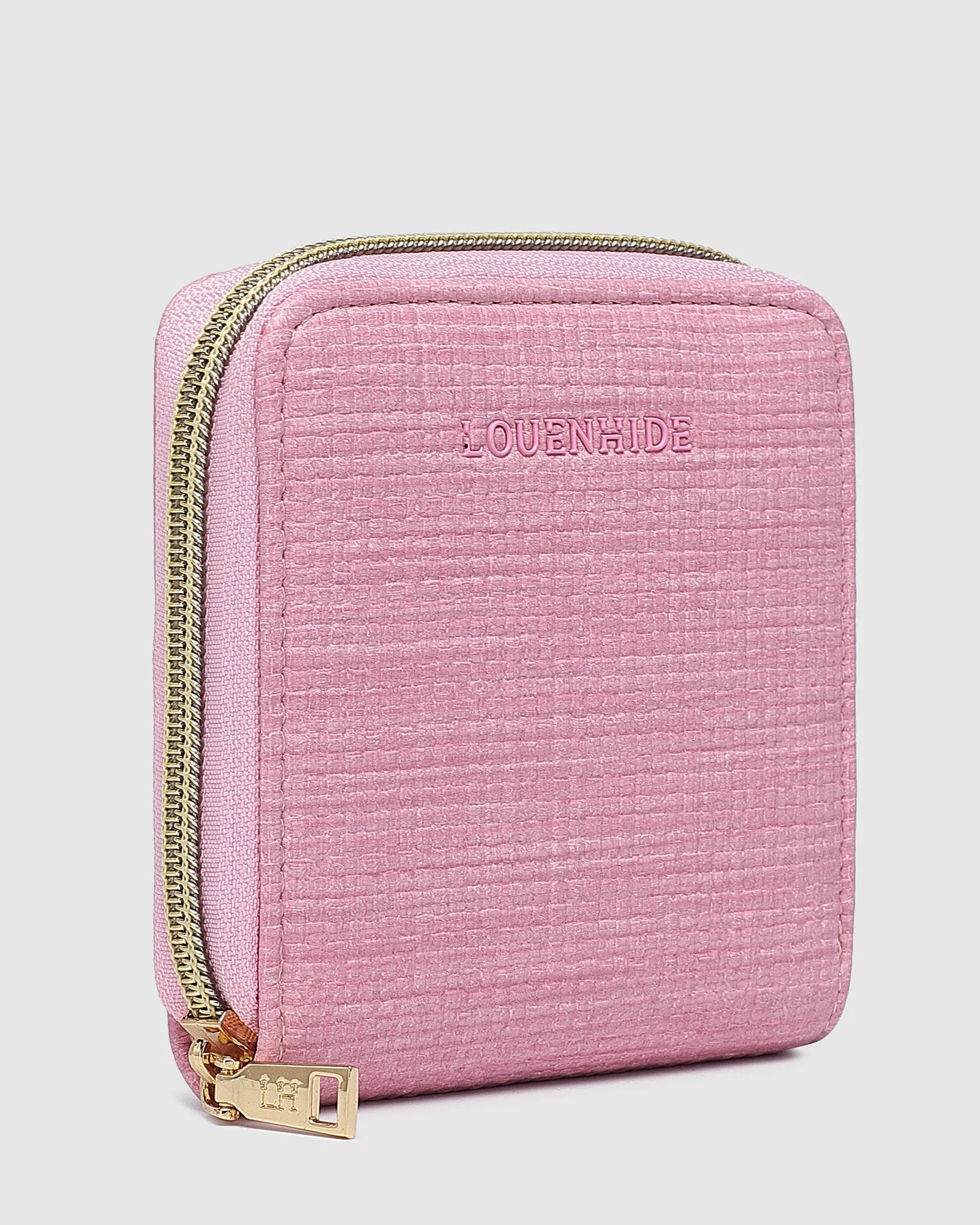 The Louenhide Juniper Jewelry Case is ideal for those who appreciate the finer details in their jewelry storage. Designed with your dynamic lifestyle in mind, this jewellery wallet is compact and portable. Whether placed on your vanity at home or tucked into your luggage for travel, the Juniper&nbsp;ensures your favourite pieces are protected wherever you go. Organize your pieces with the two press stud hooks, slip pocket, drawstring bag, ring roll and earring press stud band. Structured and protecte