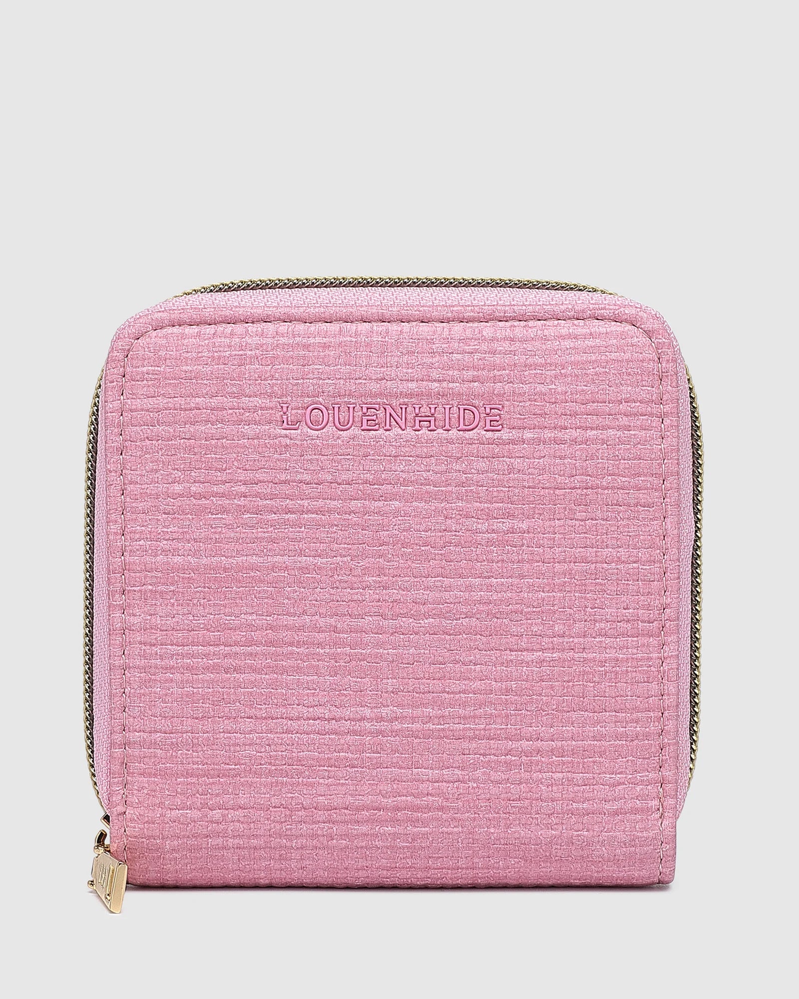 The Louenhide Juniper Jewelry Case is ideal for those who appreciate the finer details in their jewelry storage. Designed with your dynamic lifestyle in mind, this jewellery wallet is compact and portable. Whether placed on your vanity at home or tucked into your luggage for travel, the Juniper&nbsp;ensures your favourite pieces are protected wherever you go. Organize your pieces with the two press stud hooks, slip pocket, drawstring bag, ring roll and earring press stud band. Structured and protecte