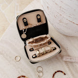 The Louenhide Juniper  Jewelry Case is ideal for those who appreciate the finer details in their jewelry storage. Designed with your dynamic lifestyle in mind, this jewellery wallet is compact and portable. Whether placed on your vanity at home or tucked into your luggage for travel, the Juniper ensures your favourite pieces are protected wherever you go. Organize your pieces with the two press stud hooks, slip pocket, drawstring bag, ring roll and earring press stud band. Structured and protected, th