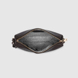 A dark brown leather pouch shown open from a top-down view, revealing a textured gray interior lining with gold-tone zipper pulls, set against a solid light gray background.