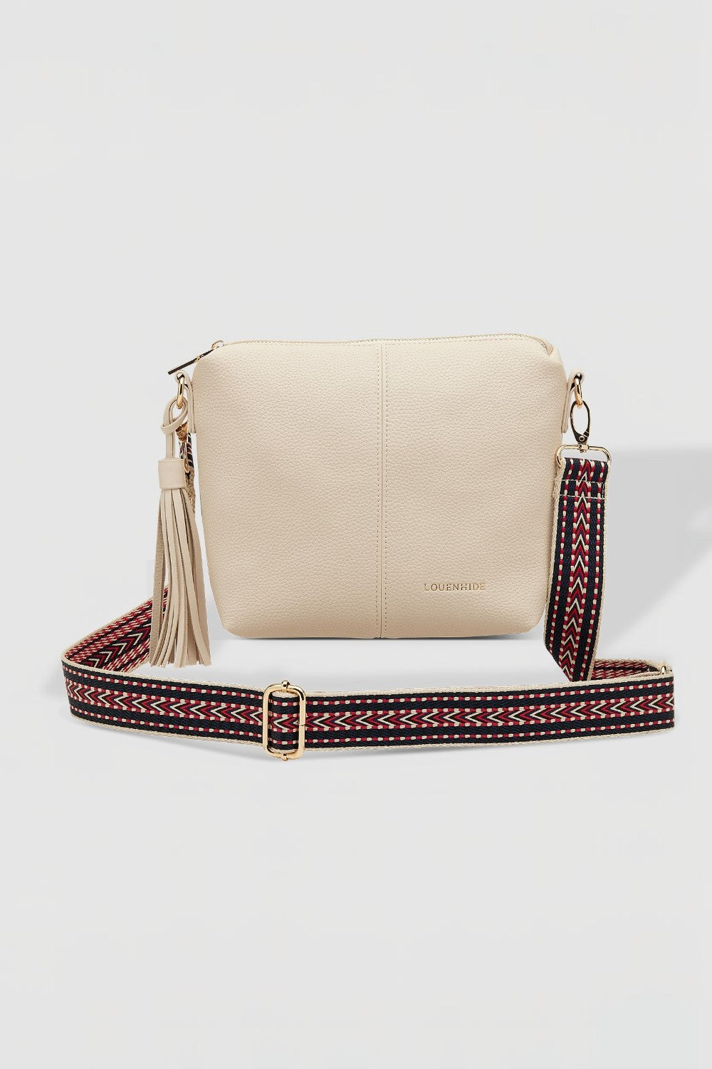 Beige handbag with a colorful strap on a white background