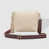 Beige handbag with a colorful strap on a white background