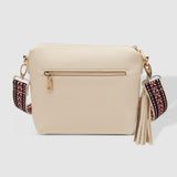 Beige handbag with colorful strap and tassel on a white background