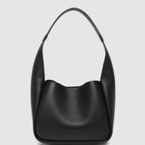Black handbag on a light gray background