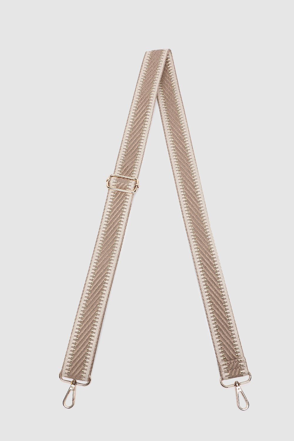 Beige bag strap on a light gray background