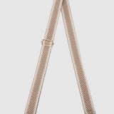 Beige bag strap on a light gray background