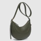 An olive green crescent-shaped leather shoulder bag with a matching adjustable shoulder strap, set against a light gray background.