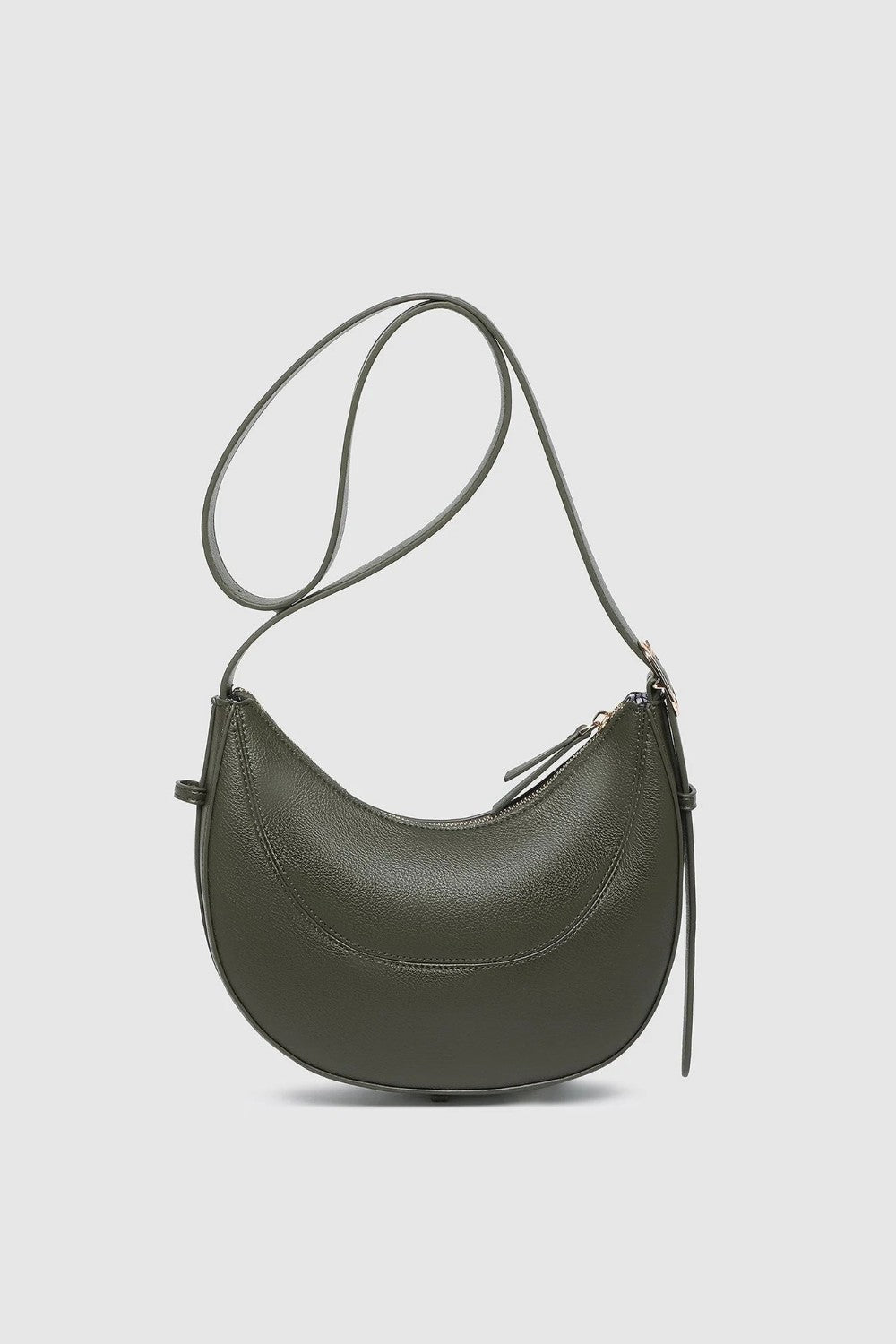 An olive green crescent-shaped leather shoulder bag with a thin matching shoulder strap and gold-tone hardware, shown against a light gray background.