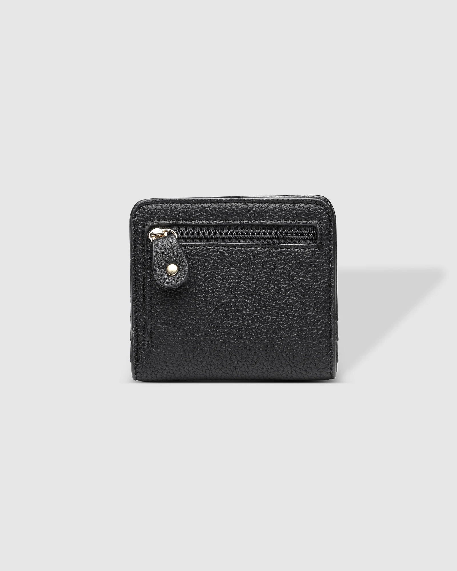 The Louenhide Lily Wallet is a must-have for the minimalist seeking a sleek and efficient way to carry their essentials. The ultimate accessory for compact organization and style, this refined design offers 7 cardholders and a secure zip pocket, so you won’t be fumbling through your wallet to find the right card or your loose change. Crafted from a luxe vegan leather, the Lily Wallet boasts a slim profile that easily slips into any pocket or bag without adding unnecessary bulk.