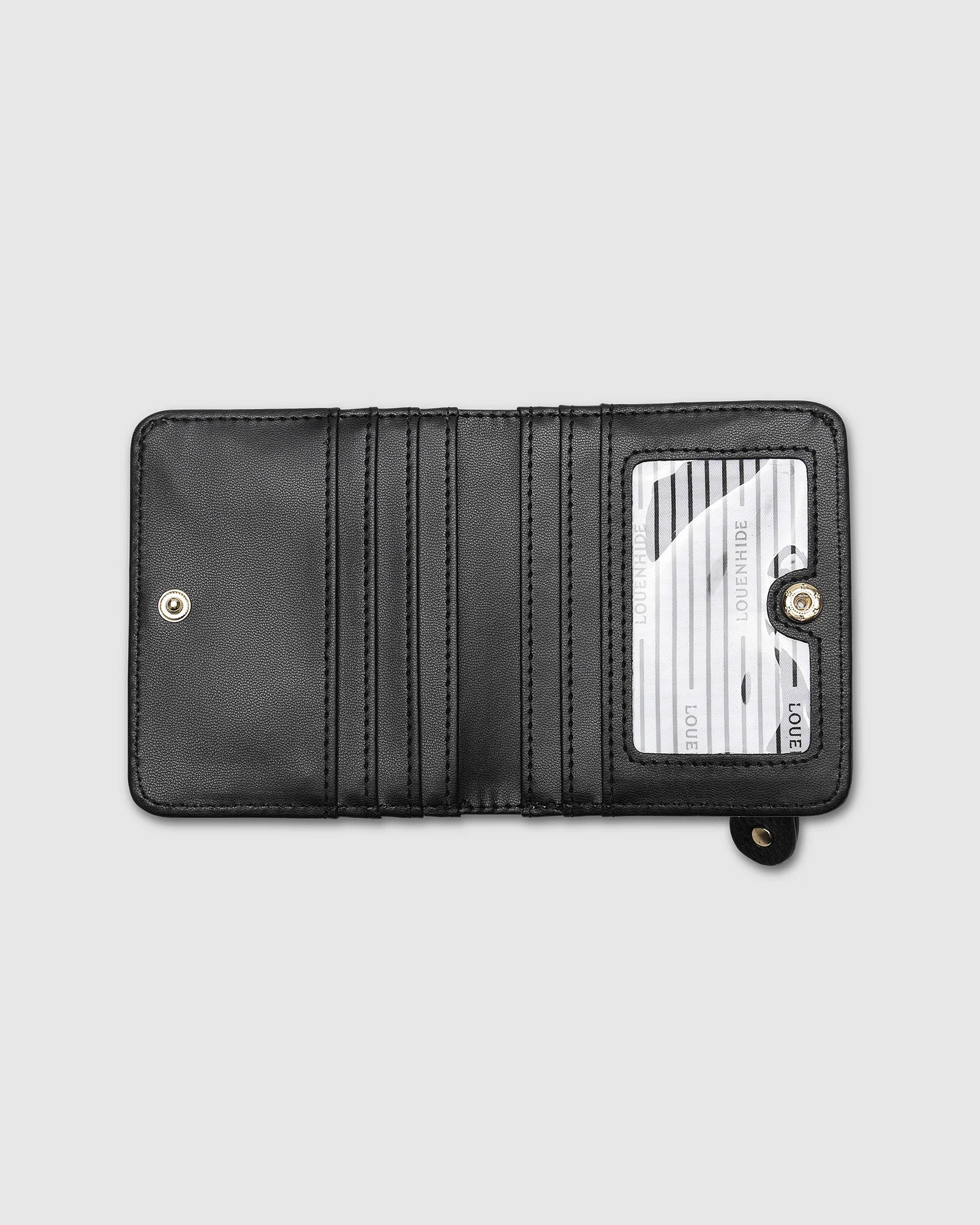 The Louenhide Lily Wallet is a must-have for the minimalist seeking a sleek and efficient way to carry their essentials. The ultimate accessory for compact organization and style, this refined design offers 7 cardholders and a secure zip pocket, so you won’t be fumbling through your wallet to find the right card or your loose change. Crafted from a luxe vegan leather, the Lily Wallet boasts a slim profile that easily slips into any pocket or bag without adding unnecessary bulk.