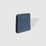 The Louenhide Lily Wallet is a must-have for the minimalist seeking a sleek and efficient way to carry their essentials. The ultimate accessory for compact organization and style, this refined design offers 7 cardholders and a secure zip pocket, so you won’t be fumbling through your wallet to find the right card or your loose change. Crafted from a luxe vegan leather, the Lily Wallet boasts a slim profile that easily slips into any pocket or bag without adding unnecessary bulk.