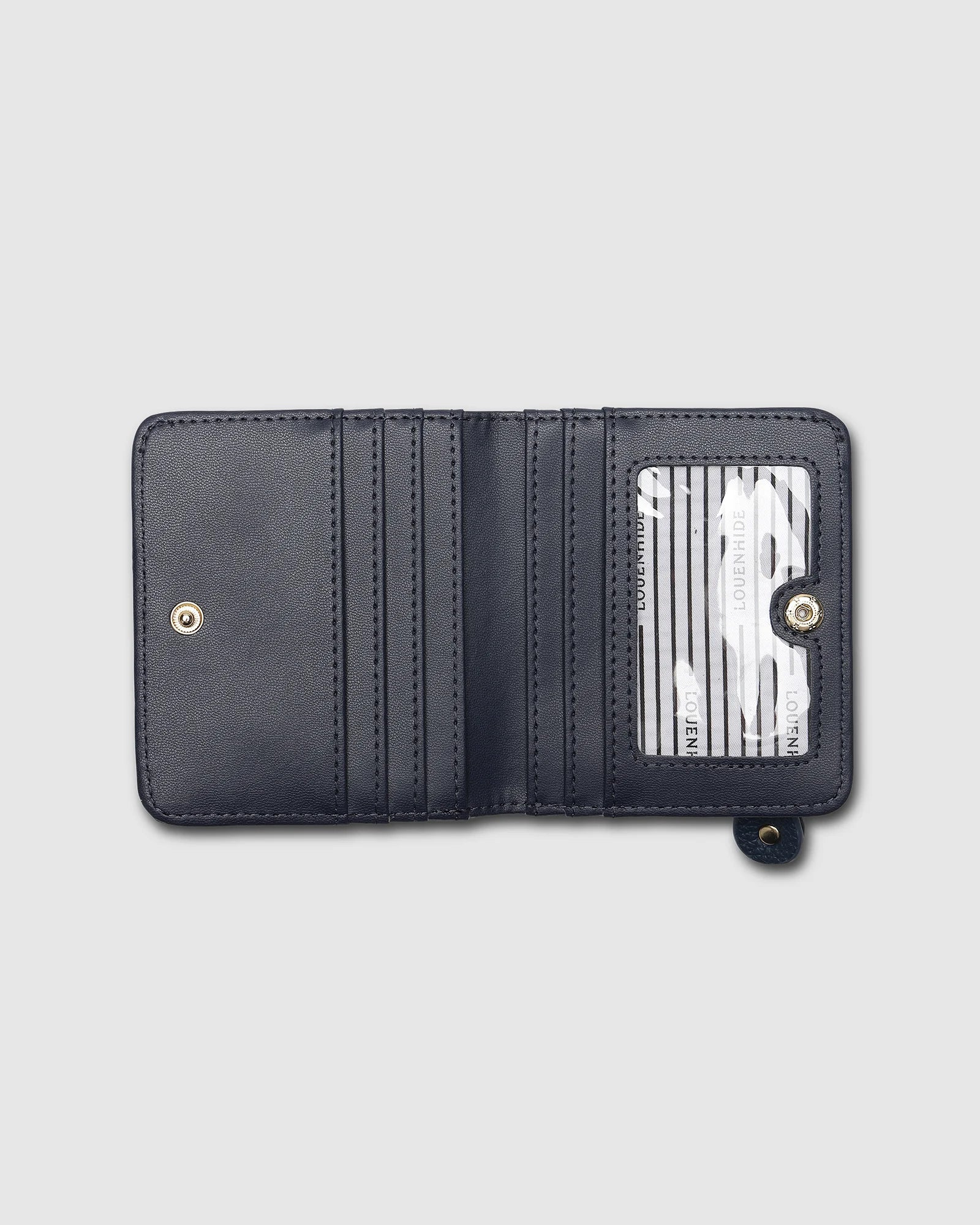 The Louenhide Lily Wallet is a must-have for the minimalist seeking a sleek and efficient way to carry their essentials. The ultimate accessory for compact organization and style, this refined design offers 7 cardholders and a secure zip pocket, so you won’t be fumbling through your wallet to find the right card or your loose change. Crafted from a luxe vegan leather, the Lily Wallet boasts a slim profile that easily slips into any pocket or bag without adding unnecessary bulk.