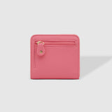 The Louenhide Lily Wallet is a must-have for the minimalist seeking a sleek and efficient way to carry their essentials. The ultimate accessory for compact organization and style, this refined design offers 7 cardholders and a secure zip pocket, so you won’t be fumbling through your wallet to find the right card or your loose change. Crafted from a luxe vegan leather, the Lily Wallet boasts a slim profile that easily slips into any pocket or bag without adding unnecessary bulk.