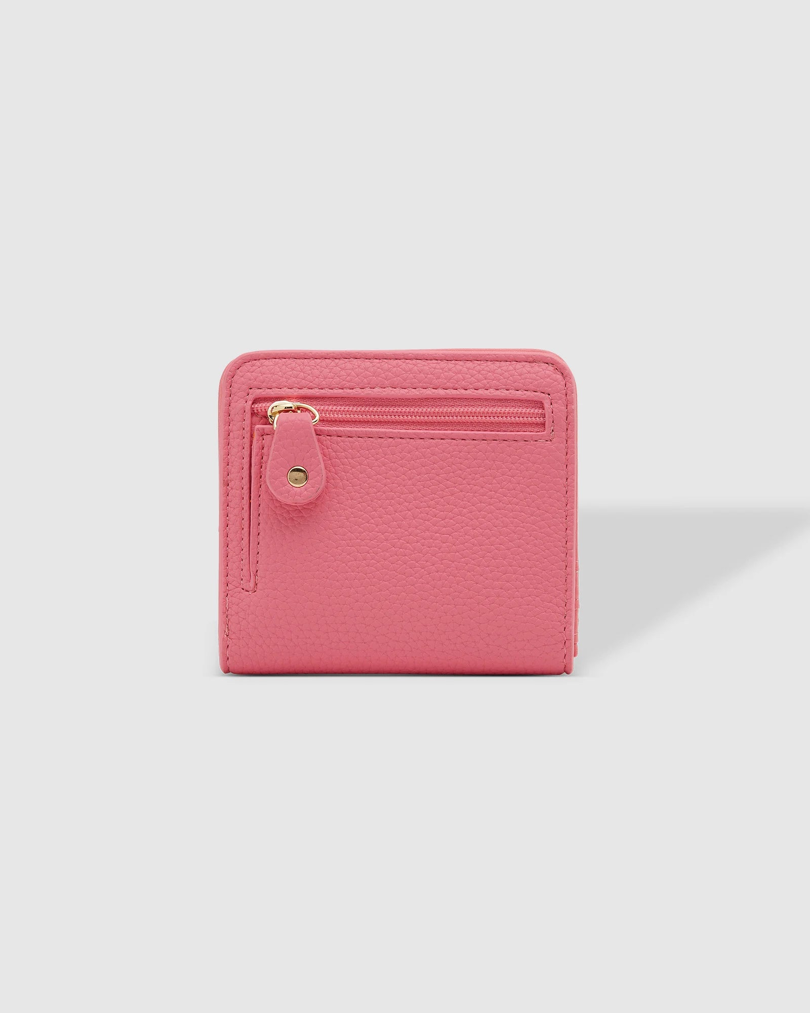 The Louenhide Lily Wallet is a must-have for the minimalist seeking a sleek and efficient way to carry their essentials. The ultimate accessory for compact organization and style, this refined design offers 7 cardholders and a secure zip pocket, so you won’t be fumbling through your wallet to find the right card or your loose change. Crafted from a luxe vegan leather, the Lily Wallet boasts a slim profile that easily slips into any pocket or bag without adding unnecessary bulk.