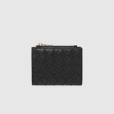 A black woven leather card holder with a gold-tone zipper pull, shown against a light gray background.