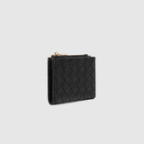 A black woven leather card holder with a gold-tone zipper pull, shown against a light gray background.
