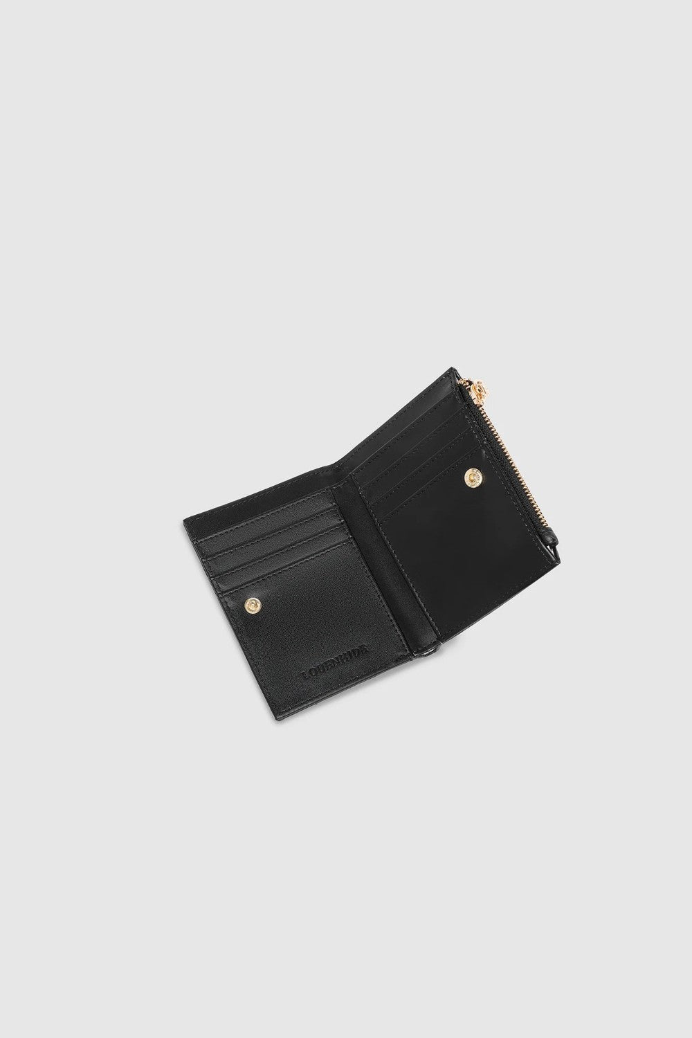 A black leather card holder with a gold-tone zipper pull, shown against a light gray background.