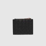 A black woven leather card holder with a gold-tone zipper pull, shown against a light gray background.