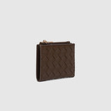 A dark brown woven leather wallet with a zippered compartment, shown open on a light background. 