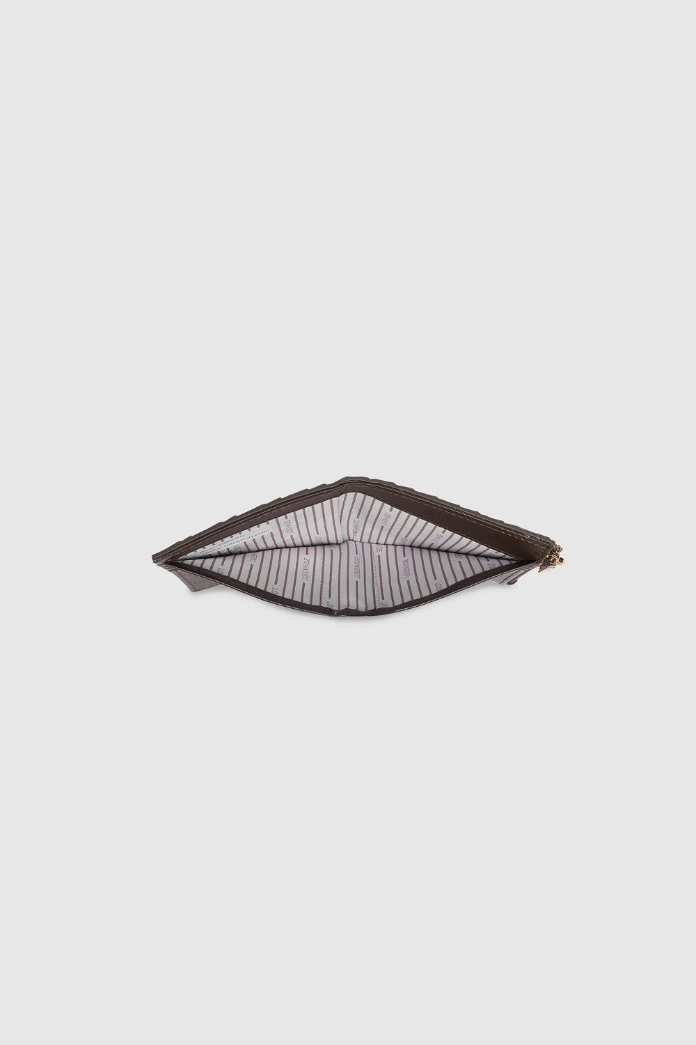 Looking down into wallet with a black and white striped lining on a light background.