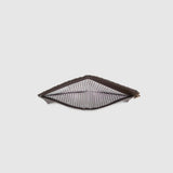 Looking down into wallet with a black and white striped lining on a light background.