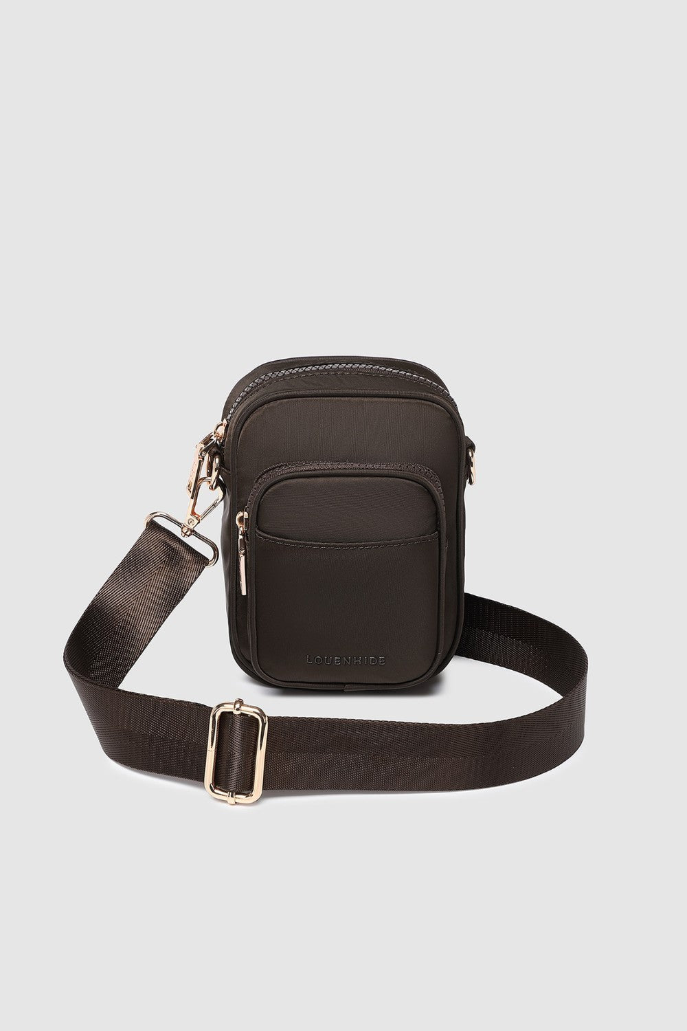 Brown crossbody bag with a strap on a light gray background