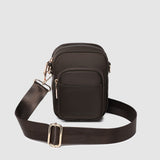 Brown crossbody bag with a strap on a light gray background