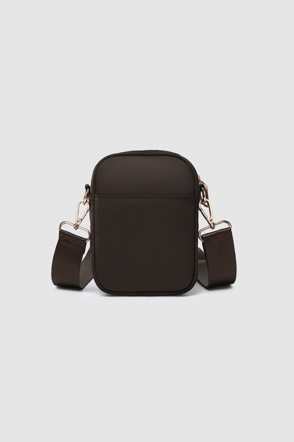 Brown crossbody bag with adjustable strap on a light gray background