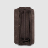 Brown pleather travel case on a light gray background