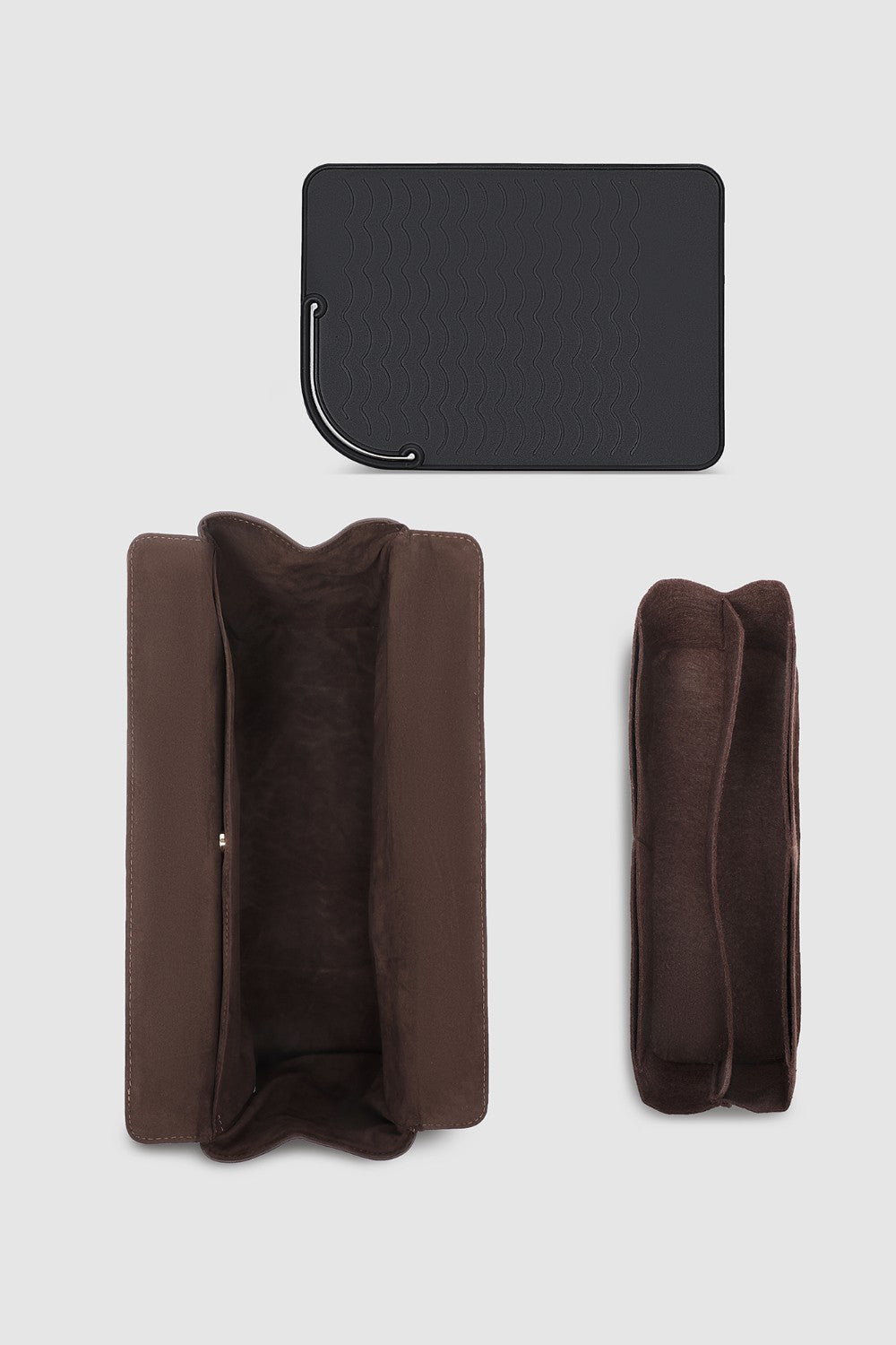 Brown pleather travel case on a light gray background