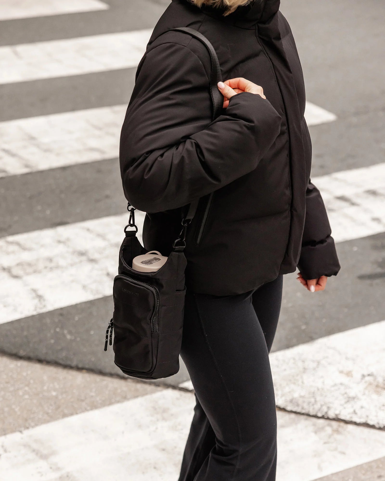 The Louenhide Miami Water Bottle Bag is a sleek, hands-free essential for an active, on-the-go lifestyle. With its slim, modern silhouette, this nylon water bottle crossbody bag is designed for effortless movement while keeping your water bottle secure and within reach.