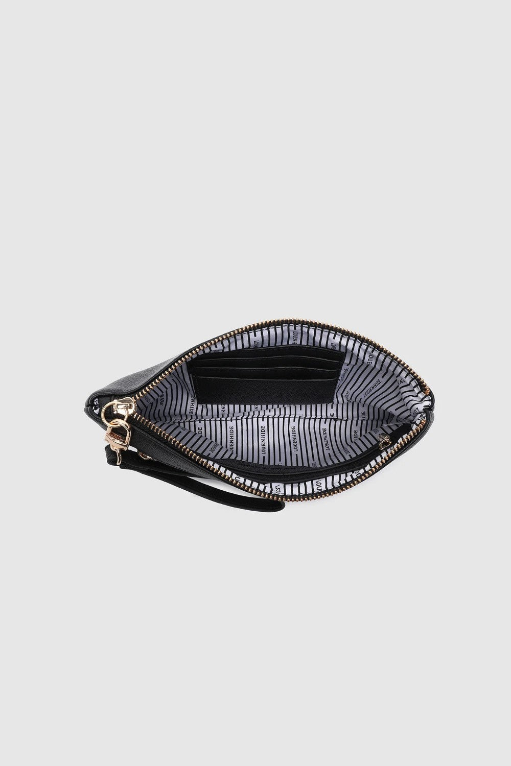 View looking down into a zippered clutch showing a black and white striped lining on a light background.