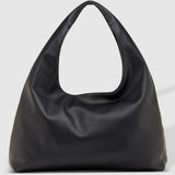 A black slouchy leather shoulder bag with a single integrated handle, photographed against a light gray studio background.