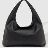 A black slouchy shoulder bag with a unique loop handle, photographed against a light gray studio background.