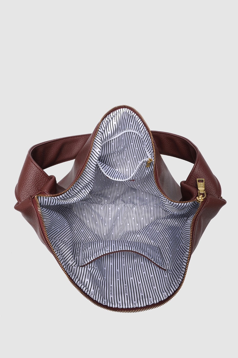 Burgundy pleather bag with striped interior on a light gray background