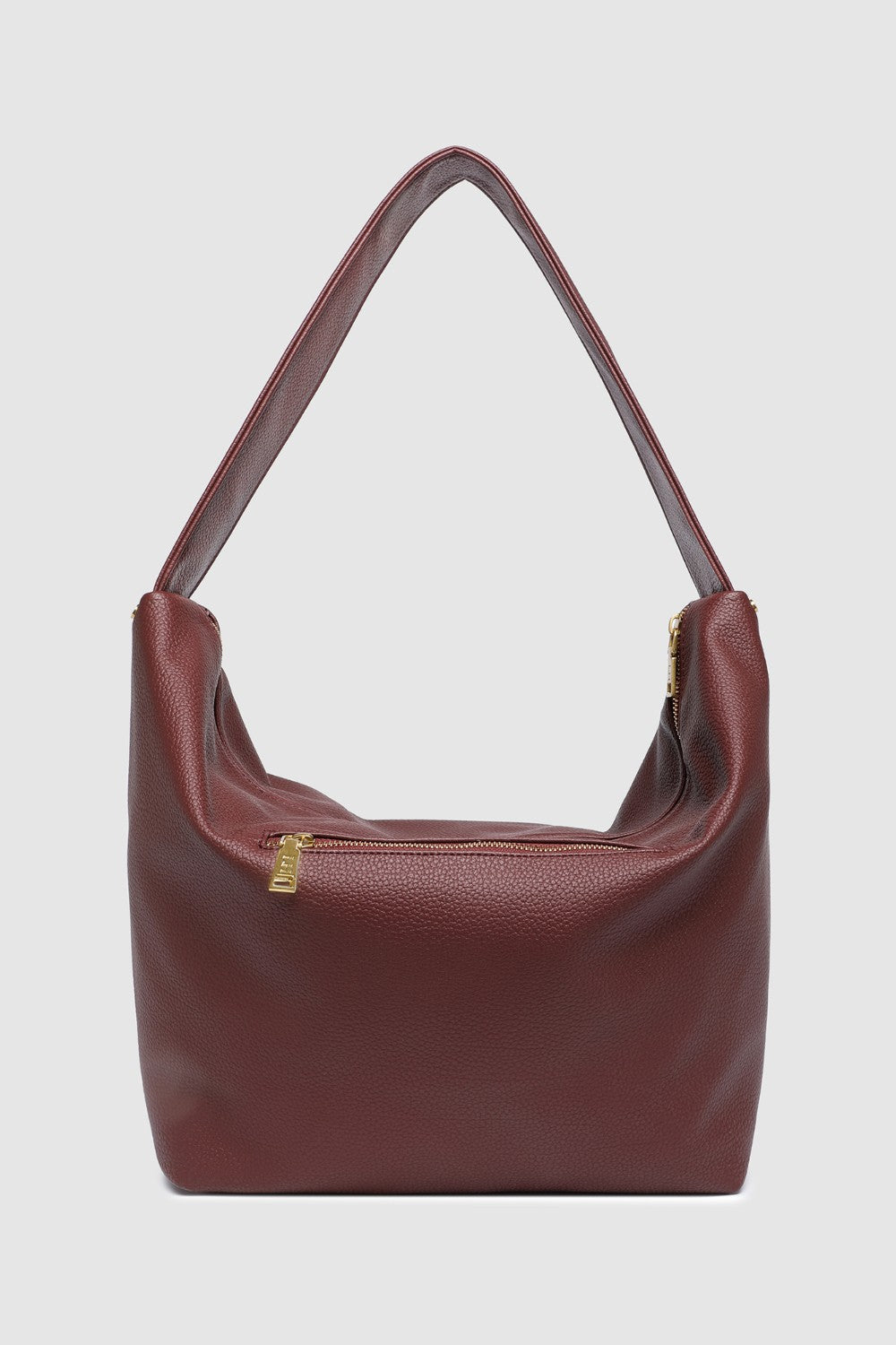 Burgundy pleather handbag with a gold zipper on a light gray background