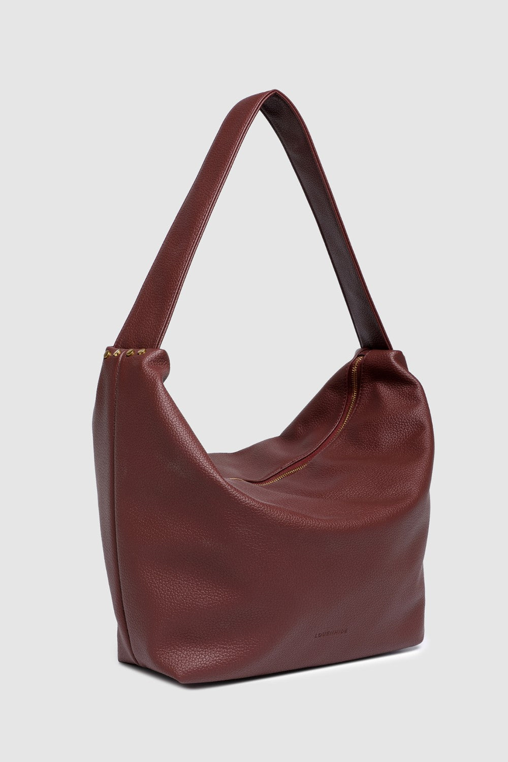 Burgundy pleather handbag on a light gray background