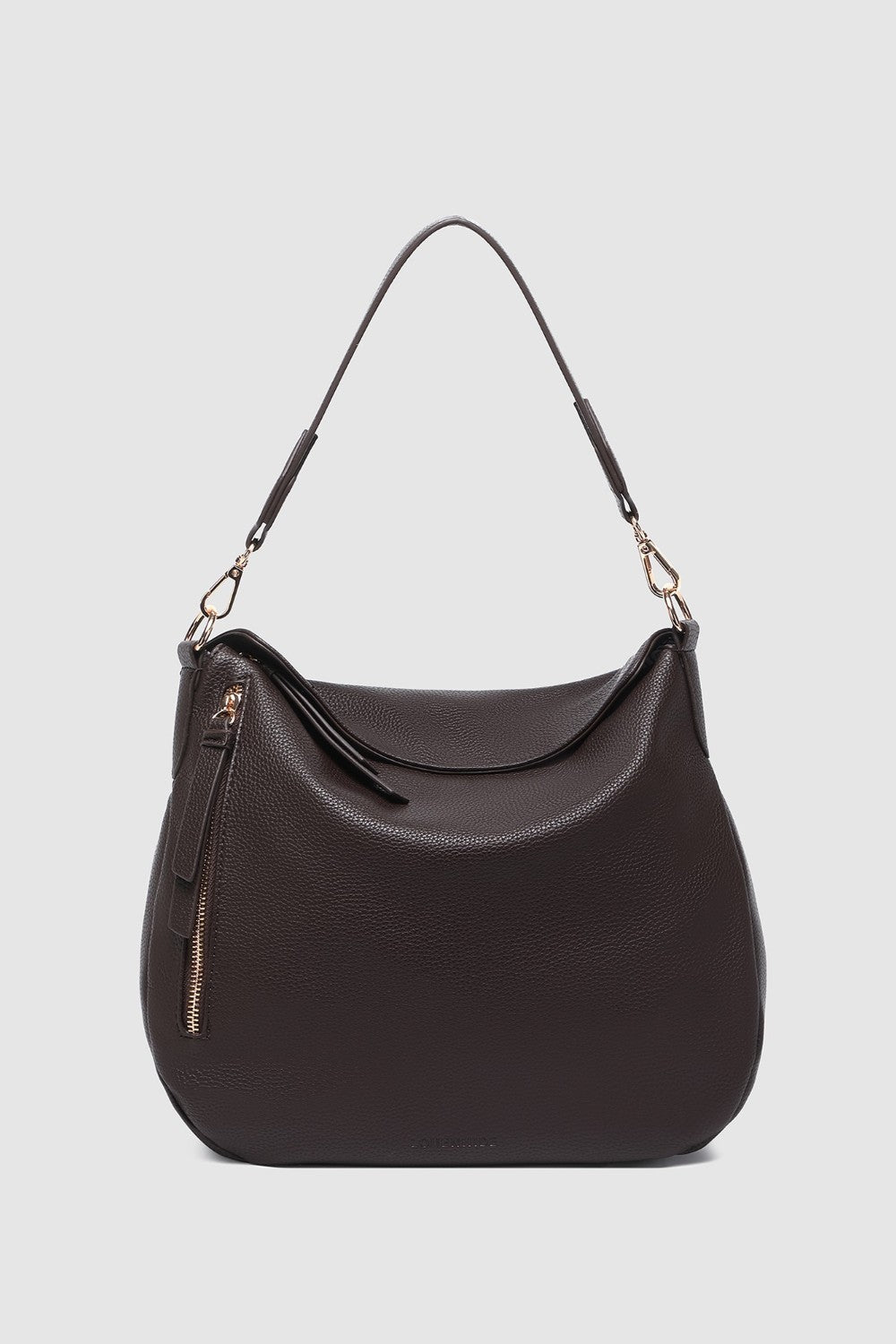 Brown handbag with a strap on a light gray background