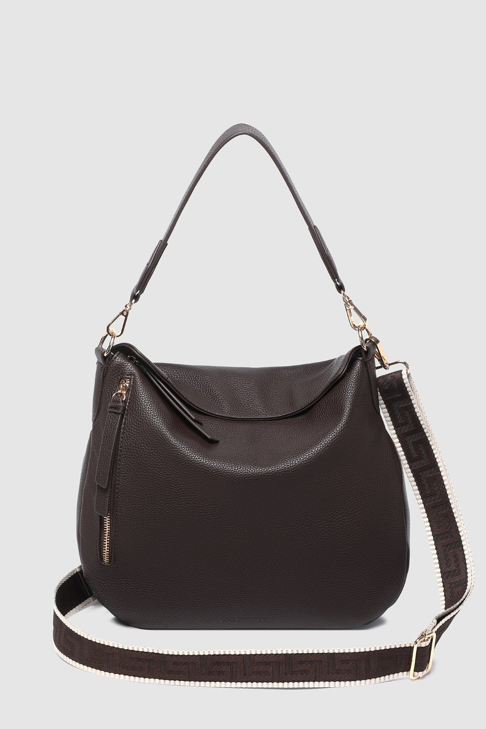 Brown handbag with a shoulder strap on a light gray background