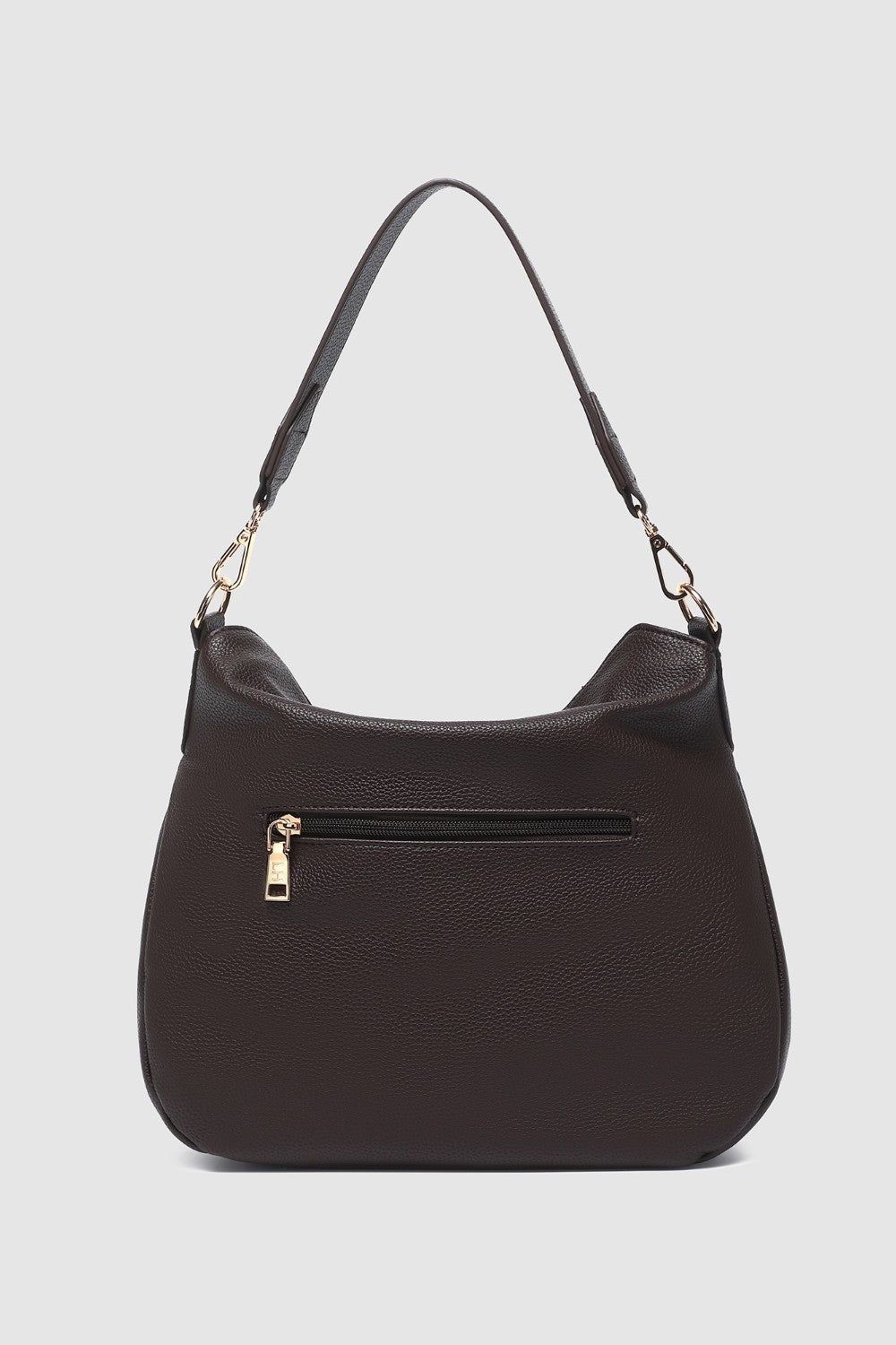 Brown handbag with a gold zipper on a light gray background