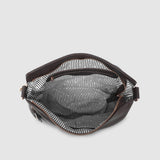 Brown handbag with a striped lining on a light gray background