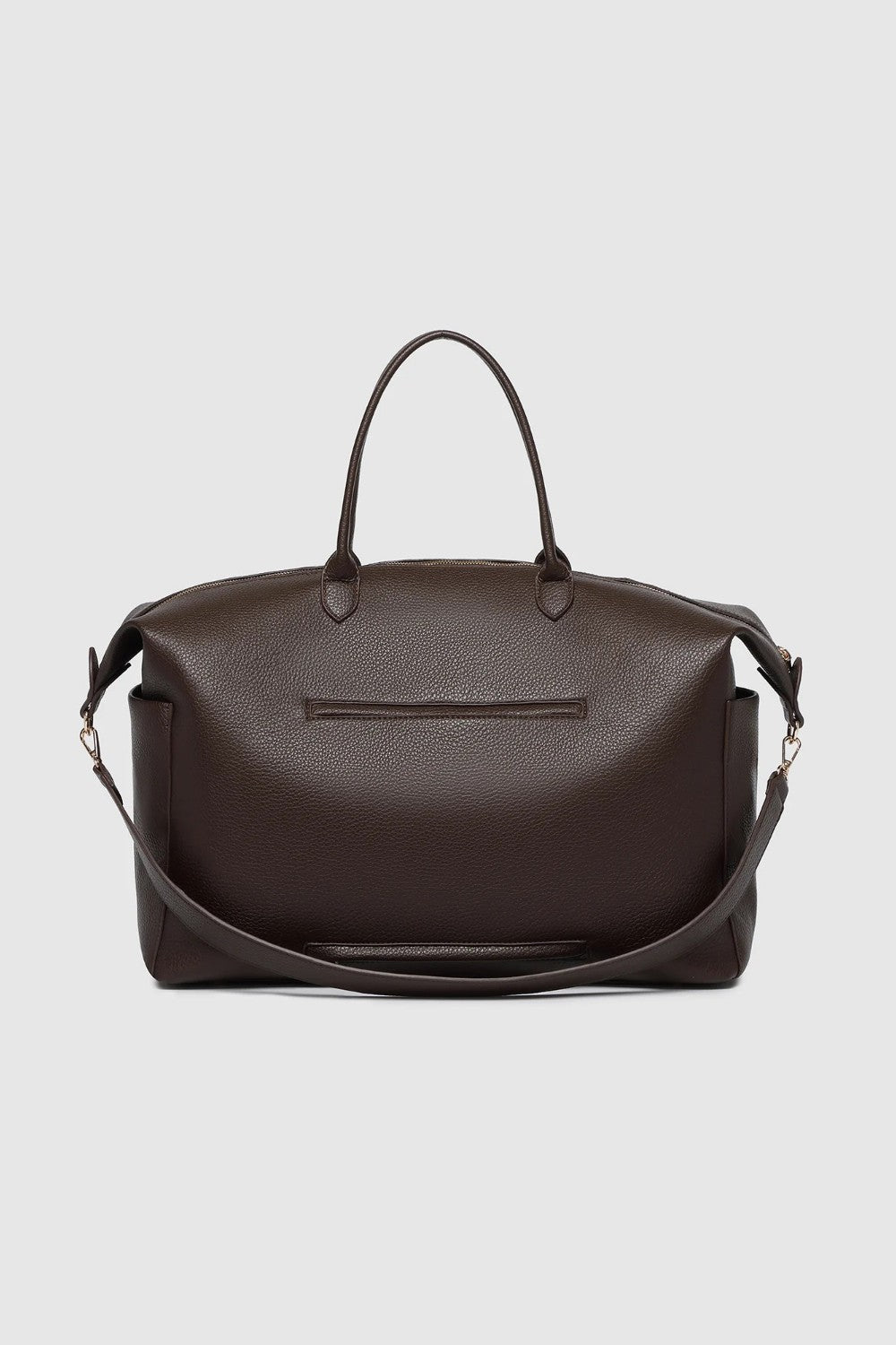 A large brown pebbled leather duffel bag with handles and a detachable strap and an exterior pocket on a light background.