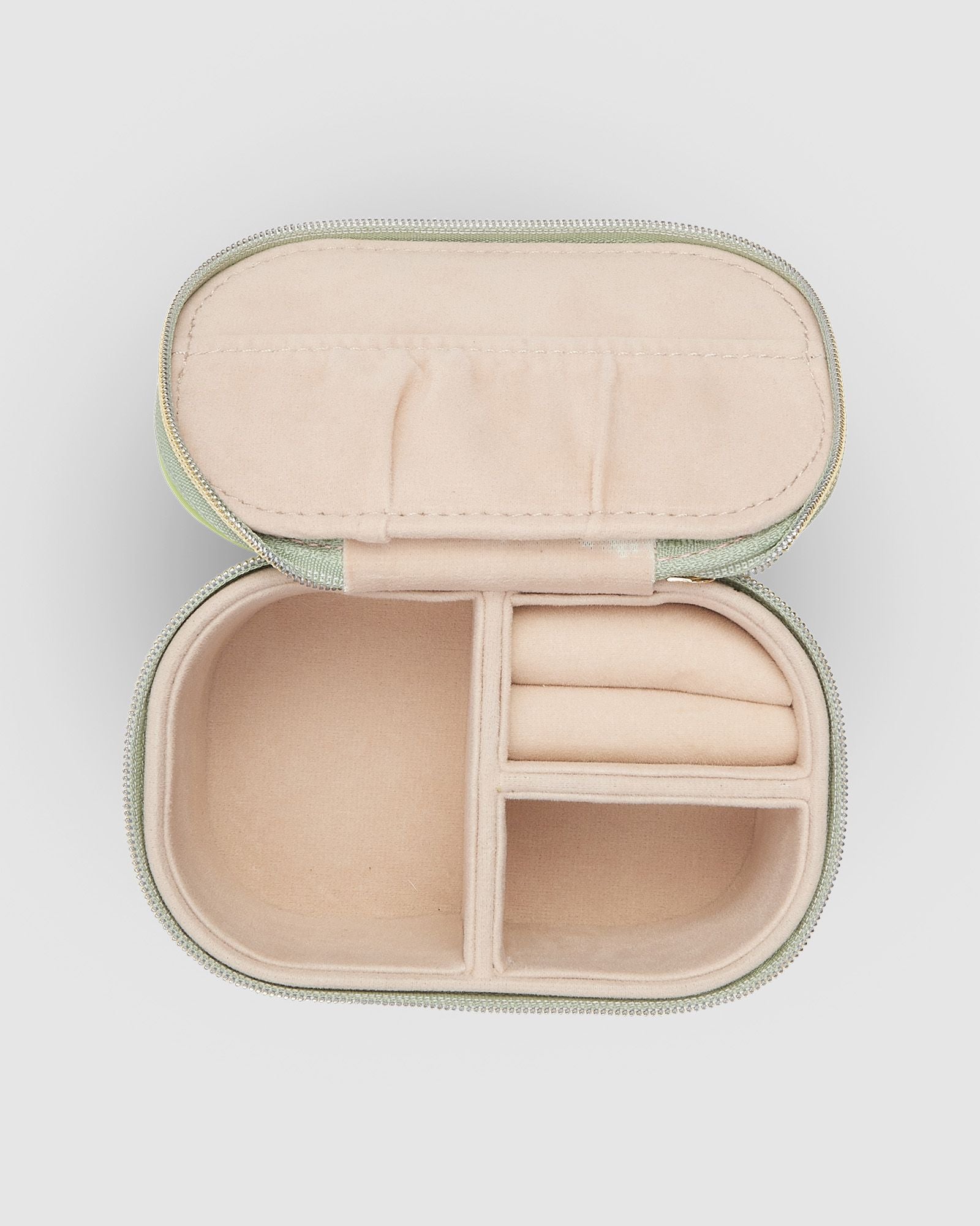 The Louenhide Olive Jewelry Box is a sweet oblong accessories box perfect for travel or everyday use. Keep your jewelry safe and secure in Olive’s separate compartments, elasticated pocket, and ring rolls. This affordable jewelry case is versatile and will fit comfortably in your handbag for on-the-go styling!