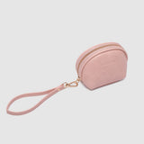 Pink pouch with a strap on a light gray background