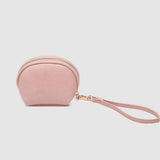 Pink wristlet purse on a light gray background