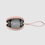Open pink wristlet purse on a light gray background