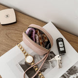 Pink pouch with keys on a magazine