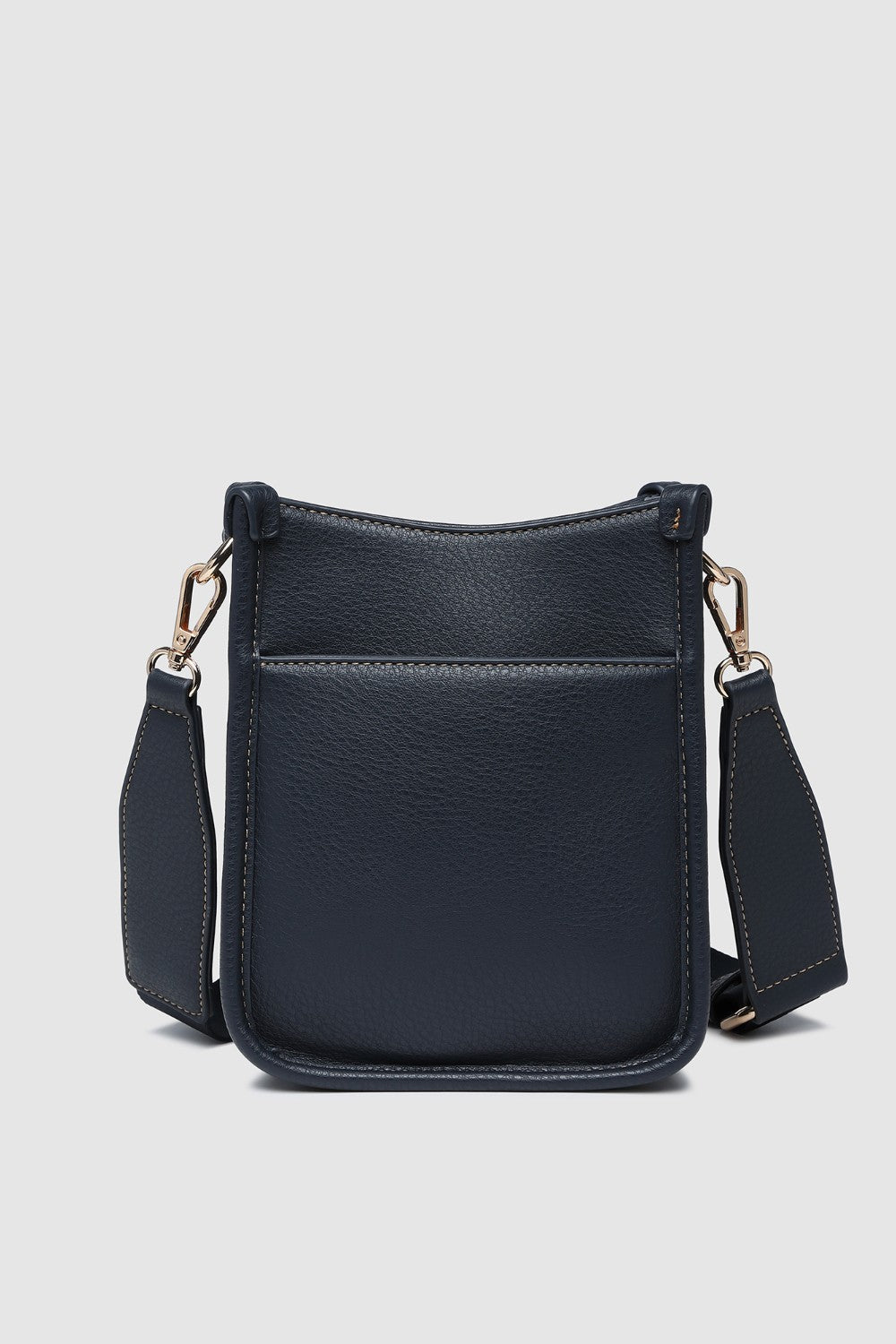 Navy pleather crossbody bag on a light gray background